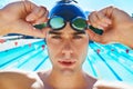 Man, swimming pool and prepare in portrait with goggles, cap or sport with exercise for wellness, health or fitness Royalty Free Stock Photo