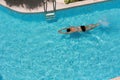 Man is swimming in pool on top view Royalty Free Stock Photo