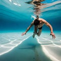 Man swimming in a pool underwater