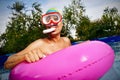 Man swimming in a portable swimming pool