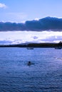 Man swimming in a quiet bay near kenmare