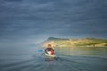 A man in a sea kayak on Lake Baikal Royalty Free Stock Photo