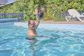 A man swims in a pool in the courtyard Royalty Free Stock Photo