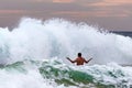 Man swims in the surf during a storm