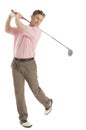 Man Swinging Golf Club Against White Background Royalty Free Stock Photo