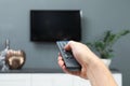 Man switching channels on plasma TV Royalty Free Stock Photo