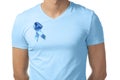 Man with symbolic blue ribbon on white background. Prostate cancer concept