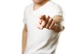 A man in a t-shirt shows a finger in the screen. Close up. Isolated background Royalty Free Stock Photo