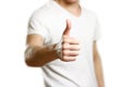 A man in a t-shirt shows his thumb up. Close up. Isolated background Royalty Free Stock Photo