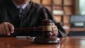 Man at Table With Wooden Gavel