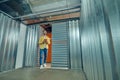 Man with tablet entering garage box