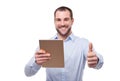 Man with tablet makes a gesture thumb up Royalty Free Stock Photo