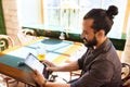 Man with tablet pc drinking beer at bar or pub Royalty Free Stock Photo