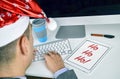 Man with a tablet with text ho ho ho in his office