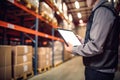 A man with a tablet in warehouse. Royalty Free Stock Photo