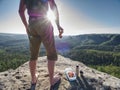 Man take brak for snack while climbing in rocks. Hiker in shorts Royalty Free Stock Photo