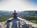 Man take brak for snack while climbing in rocks. Hiker in shorts Royalty Free Stock Photo