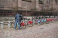 Man take a city bike vacation at the parking in the paved alley