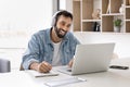 Man take part in online class using laptop and application Royalty Free Stock Photo