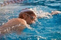 Man take part in swimming competition Royalty Free Stock Photo