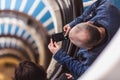 Man take photo old blue spiral staircase, spiral stairway inside an old house in Budapest, Hungary. Project Budapest 100