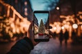 Man take shot on smartphone Christmas tree on the night city street Royalty Free Stock Photo