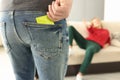 Man takes condom out of his pocket woman opposite stretches out her hand to him. Royalty Free Stock Photo