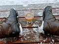 a man takes a glass of beer and toasts his health in the middle of winter Royalty Free Stock Photo