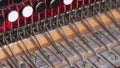 The man takes off the right cover of the button accordion. Checks the condition of the keys and valves. Bayan repair and