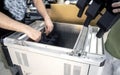 Man takes out model printed 3D printer from workspace big industrial 3D printer