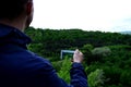 Man takes photo of green forest. Kislovodsk, Russia