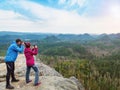 Man takes photo of photographing woman with smart phone Royalty Free Stock Photo