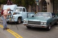 Man takes a picture of the Chevrolet El Camino 1965 Royalty Free Stock Photo