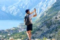 A man takes a picture on a smartphone from the mountains Royalty Free Stock Photo