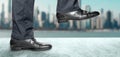 Man takes step in classic shoes. Motivation and challenging. Close up legs of businessman walking stepping up stair in modern city