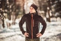 Man Taking Break From Running in Extreme Snow Conditions