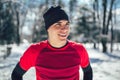 Man Taking Break From Running in Extreme Snow Conditions