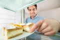 Man Taking Cake View From Inside The Refrigerator Royalty Free Stock Photo