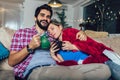 Man taking care of his sick girlfriend lying on the sofa