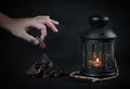 Man Taking Dates. Ramadan Candle Lantern with Wooden Prayer Bead