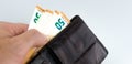 Man taking fifty Euro banknotes out of a brown leather wallet Royalty Free Stock Photo