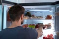 Man Taking Food From Refrigerator Royalty Free Stock Photo