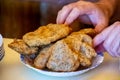 Man taking fritters made of wheat and buckwheat flour Royalty Free Stock Photo
