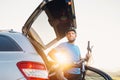 Man taking his bicycle out from the trunk of a car Royalty Free Stock Photo