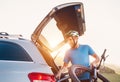 Man taking his bicycle out from the trunk of a car. Sport leisure concept image Royalty Free Stock Photo