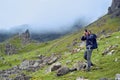 Man taking images of the beautiful scottish landscape