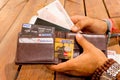 Man taking indian payment options out of a wallet