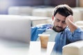 Man taking a nap while sitting and waiting for his flight in cafe at airport Royalty Free Stock Photo