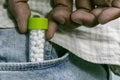 Man taking out Homeopathic pills bottle from the jeans pocket Royalty Free Stock Photo