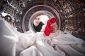 Man Taking Out Red Sock Mixed With White Laundry From Washing Machine